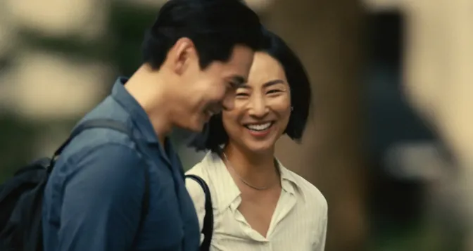 Greta Lee and Teo Yoo smiling